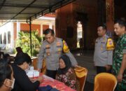 Polres Nganjuk bersama Kodim 0810/Nganjuk Gelar Bansos dan Pengobatan Gratis bagi Warga Desa Sidokare