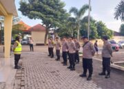 Waka Polsek Plemahan Pimpin Pengamanan Olahraga Jalan Sehat dan Senam Bersama HUT Koperasi ke 77